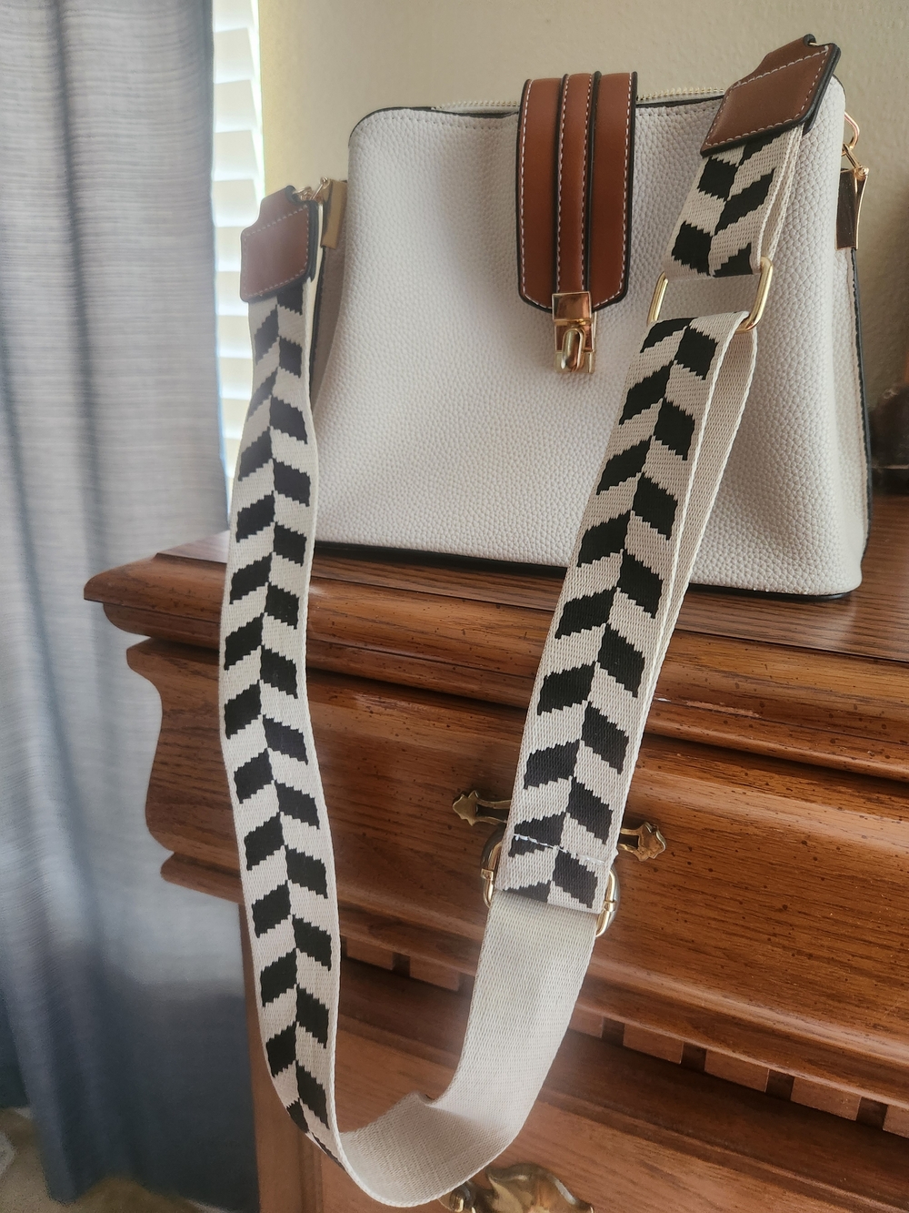 New White Pebbled Crossbody Bag with Tan Leather Trim and Black Chevron Strap